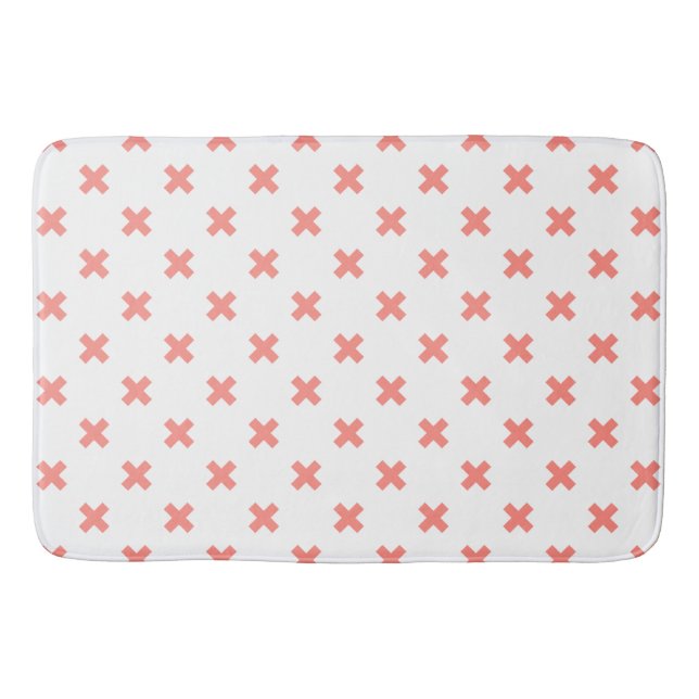Peach cross stitches on white bath mat (Front)
