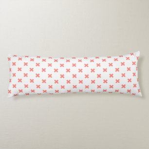 Peach cross stitches on white body pillow