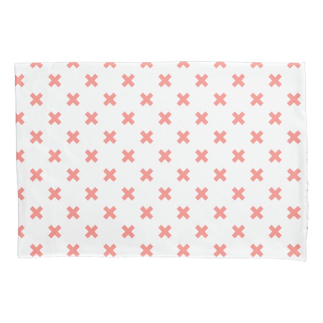 Peach cross stitches on white pillowcase (Front)