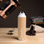 Peach Personalized Wedding Bridesmaid Water Bottle<br><div class="desc">Gift your wedding bridesmaid or maid of honour with this trendy, vacuum Insulated water bottle that features her name in white, stylized script on a peach colour background designed to match your wedding colour scheme. Personalize bottle by editing and replacing name with your own as desired. Select your water bottle...</div>