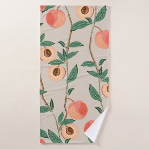 Peach tree branches with leaves and fruits on a li bath towel