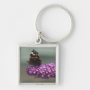Peacock butterfly on flower keychain