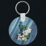 Peacocks & Emerald Green Metallic Silk Keychain<br><div class="desc">Two imperial Peacocks with slender necks ending in long extravagant decorative tail of impressive feathers curled around fragrant white Frangipani flowers on a chic emerald metallic green silk textured peacock pattern background</div>