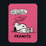 Peanuts | Life is Full of Rude Awakenings Magnet<br><div class="desc">Snoopy, the beloved beagle from the Peanuts comic strip, is known for his philosophical musings and witty observations about life. One of his famous quotes is "Life is a series of rude awakenings, " which encapsulates the idea that life often presents us with harsh realities and unexpected challenges that disrupt...</div>