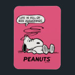 Peanuts | Life is Full of Rude Awakenings Magnet<br><div class="desc">Snoopy, the beloved beagle from the Peanuts comic strip, is known for his philosophical musings and witty observations about life. One of his famous quotes is "Life is a series of rude awakenings, " which encapsulates the idea that life often presents us with harsh realities and unexpected challenges that disrupt...</div>