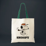 Peanuts | Snoopy Golf Swing Tote Bag<br><div class="desc">Snoopy,  the beloved beagle from the Peanuts comic strip,  is depicted in this design swinging a golf club.</div>