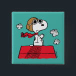 Peanuts | Snoopy the Flying Ace 2 Inch Square Button<br><div class="desc">This cute Peanuts design features Snoopy as the World War I flying ace reading to take on the Red Baron of Germany.</div>