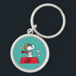 Peanuts | Snoopy the Flying Ace Keychain<br><div class="desc">This cute Peanuts design features Snoopy as the World War I flying ace reading to take on the Red Baron of Germany.</div>