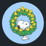 Peanuts | Snoopy & Woodstock Christmas Wreath Classic Round Sticker<br><div class="desc">Celebrate the holidays and your love of Peanuts with this cute design featuring Snoopy,  Woodstock and friends in a holiday wreath.</div>