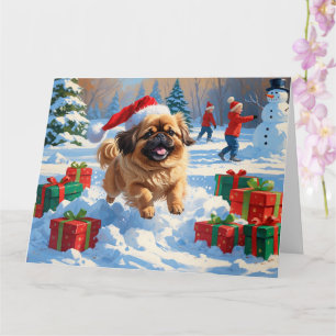 Pekingese Dog Running in Snow with Christmas Hat Card