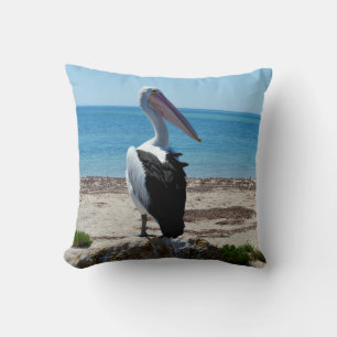 Pelican Perched On A Beach Rock, Throw Pillow