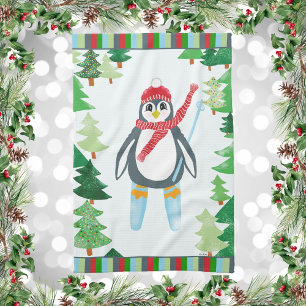 Penguin Skiing on a Mountain Of Christmas Trees Kitchen Towel