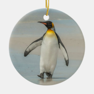 Penguin walking on the beach ceramic ornament