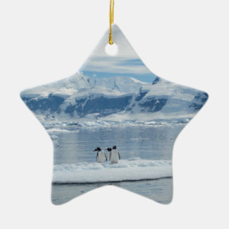 Penguins on an iceberg ceramic ornament