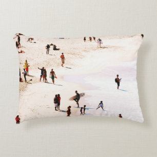 People on beach in the morning accent pillow