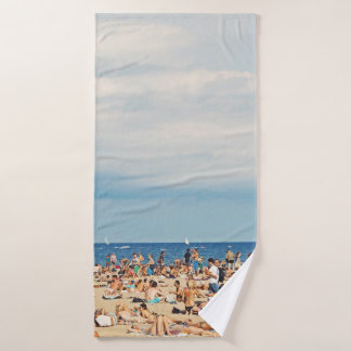 People on brown sand beach bath towel