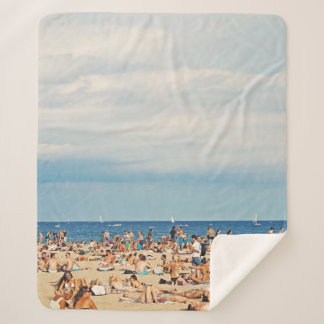People on brown sand beach sherpa blanket