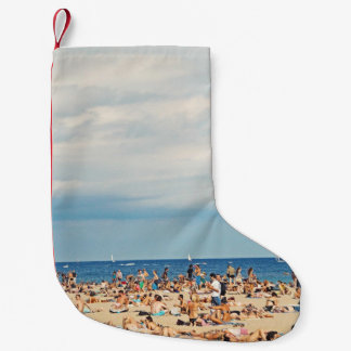 People on brown sand beach small christmas stocking