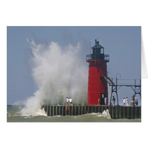 People on jetty watch large breaking waves in 2