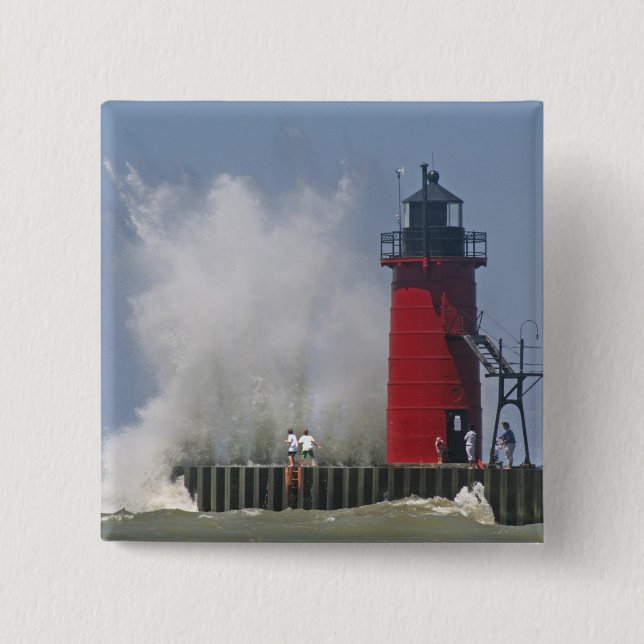 People on jetty watch large breaking waves in 2 inch square button (Front)