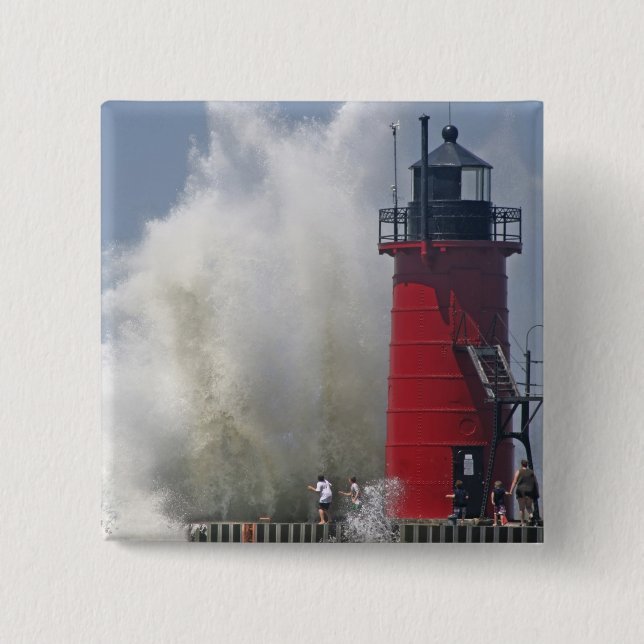 People on jetty watch large breaking waves in 2 inch square button (Front)