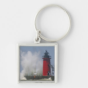 People on jetty watch large breaking waves in 2 keychain