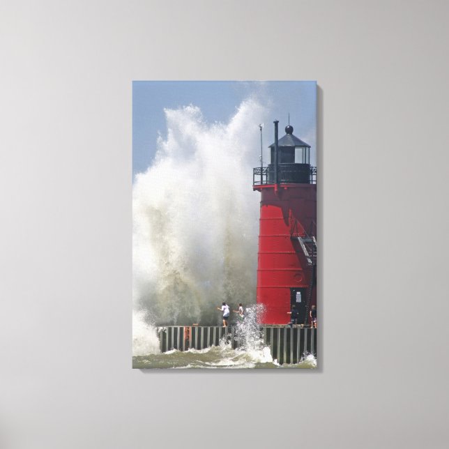 People on jetty watch large breaking waves in canvas print (Front)