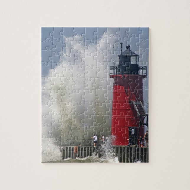 People on jetty watch large breaking waves in jigsaw puzzle (Vertical)