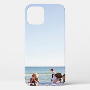 People on white sands by the beach iPhone 12 case