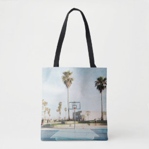 People outside outdoor basketball court tote bag