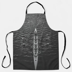PEOPLE RIDING BOAT ON BODY OF WATER APRON