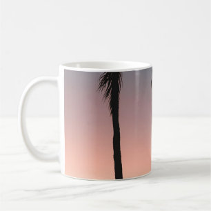 People sitting on beach near sea coffee mug