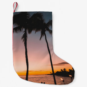 People sitting on beach near sea small christmas stocking