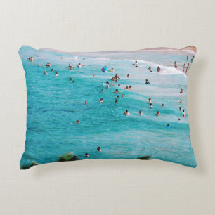 People swimming in the beach accent pillow