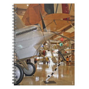 People touring National Museum of Naval Aviation Notebook