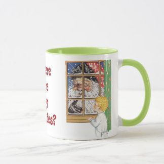 Père Noël antique remuant sa tasse de doigt