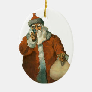 Père Noël avec un ornement de Noël d'armes