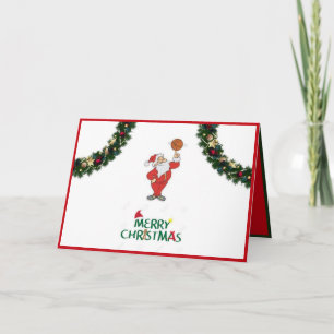 père Noël avec une carte de Noël de basket-ball