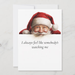 Père Noël regarde une carte de Noël drôle