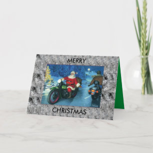 père Noël sort une carte de Noël