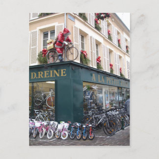 Père Noël sur la carte postale de Noël à vélo
