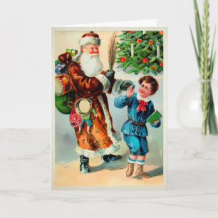 Père Noël vintage avec une carte de vacances enfan