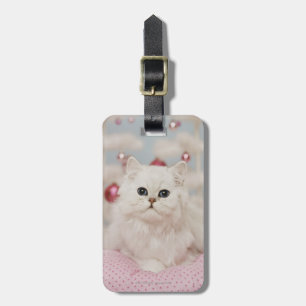 Persian cat sitting on pink pillow luggage tag