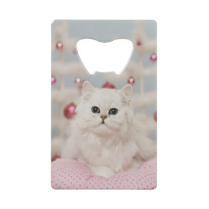 Persian cat sitting on pink pillow wallet bottle opener