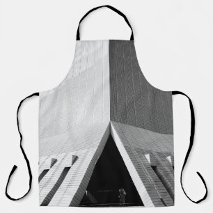 PERSON ENTERING GRAY BUILDING DOOR APRON