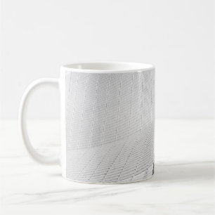 PERSON ENTERING GRAY BUILDING DOOR COFFEE MUG