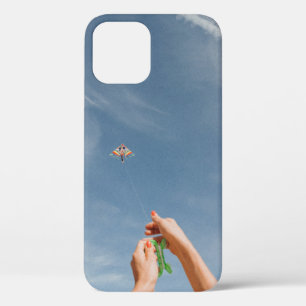 Person flying kite in the morning iPhone 12 case