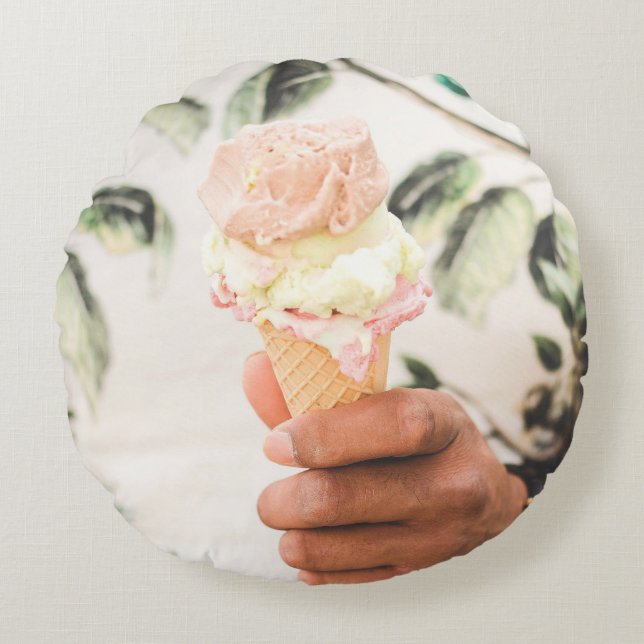 Person holding ice cream cone with three flavors o round pillow (Front)