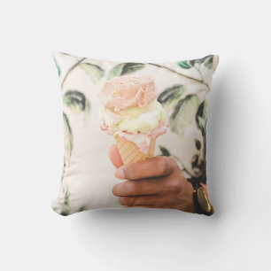 Person holding ice cream cone with three flavours  throw pillow