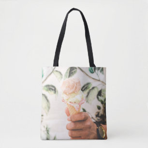 Person holding ice cream cone with three flavours  tote bag